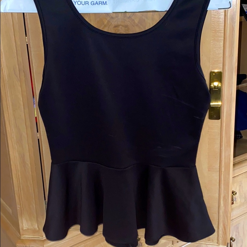 Black peplum shirt with bow on the back